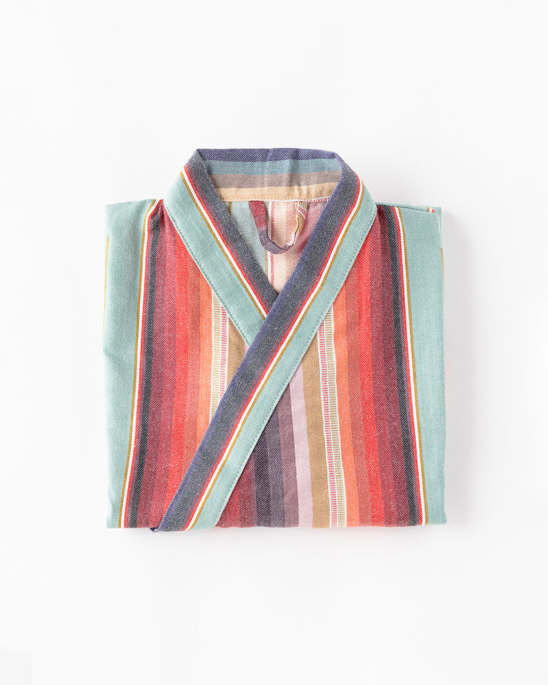 Colorful striped kids robe on a white background