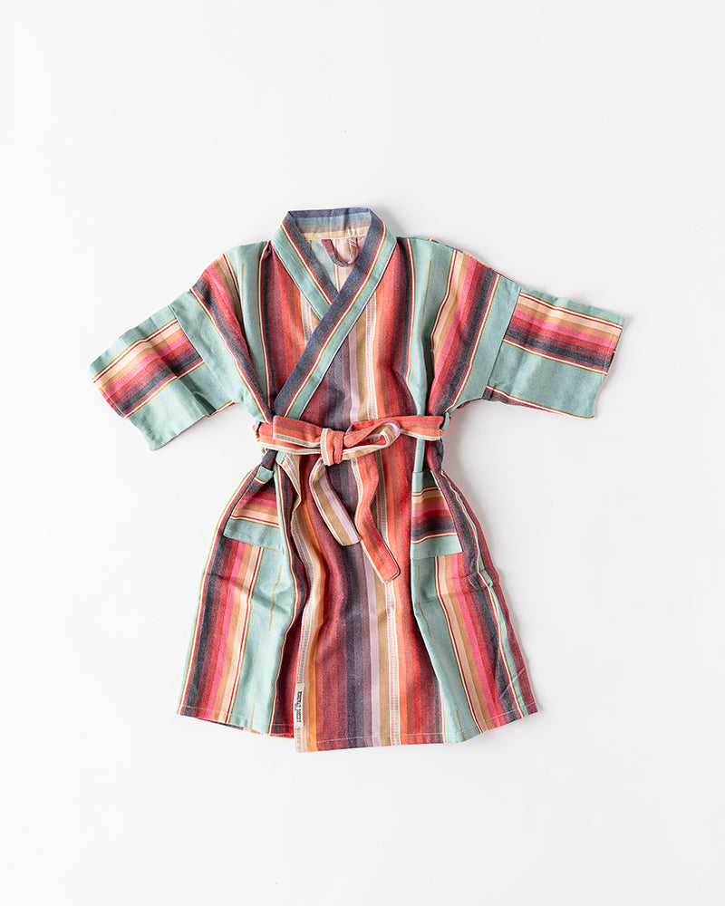 Colorful striped kids robe on a white background