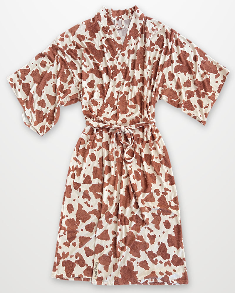 Cow print robe on white background
