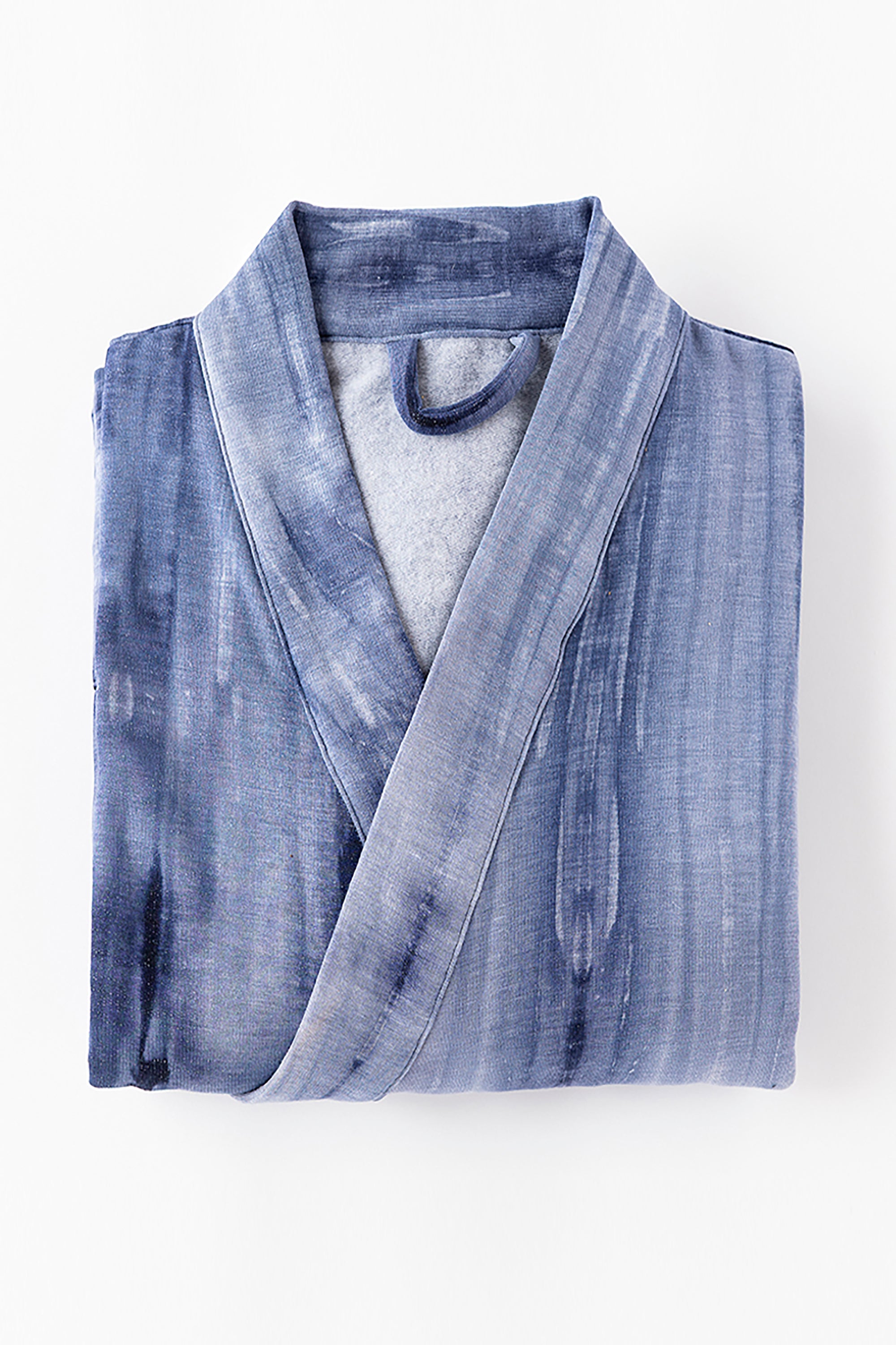 Folded blue robe on a white background
