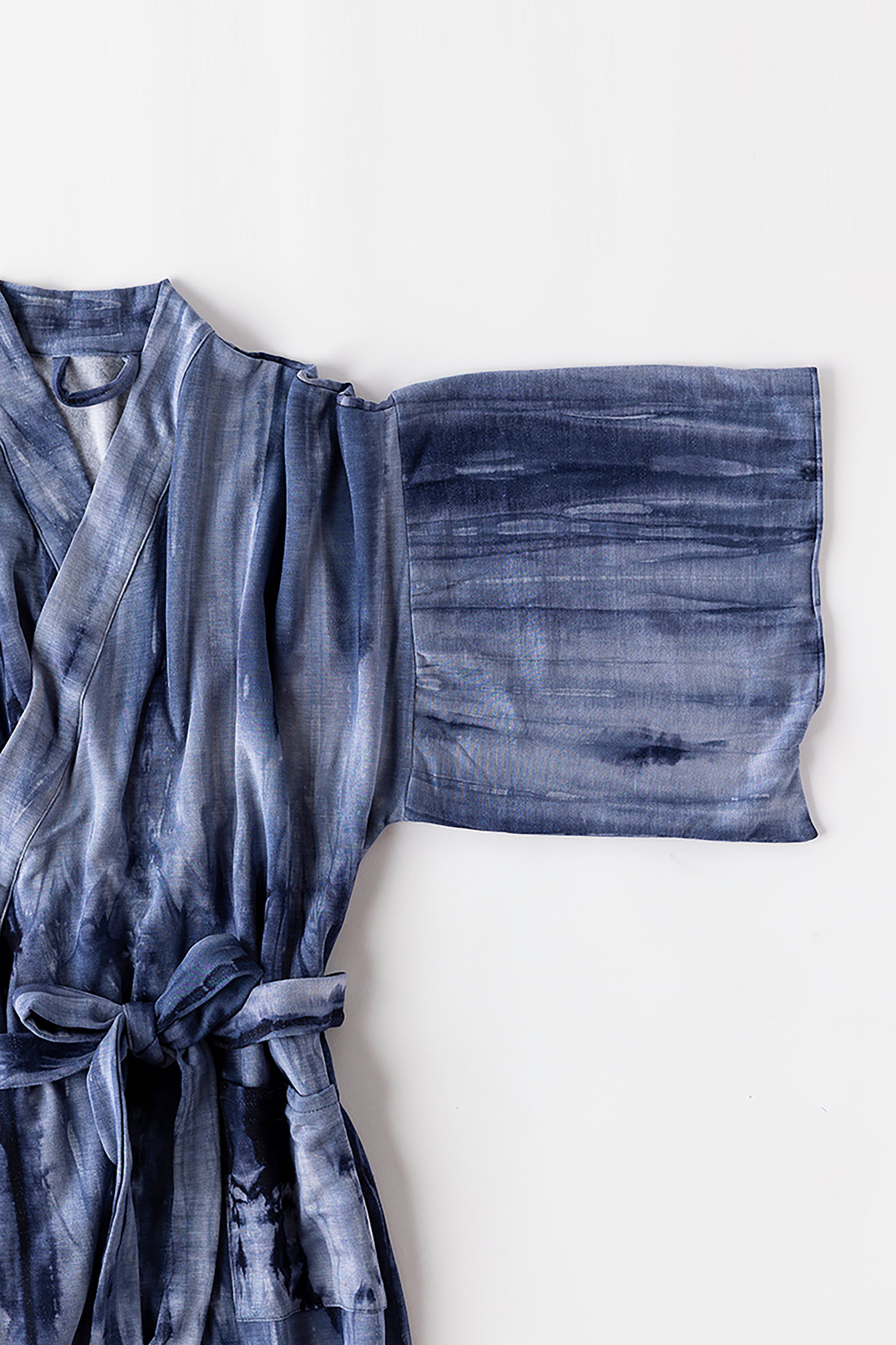 Blue tie-dye robe on a white background