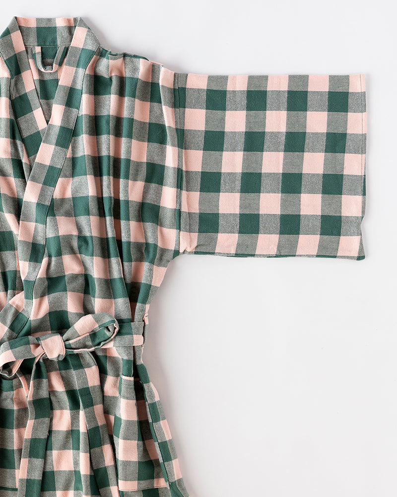 Green and pink checkered robe on a white background