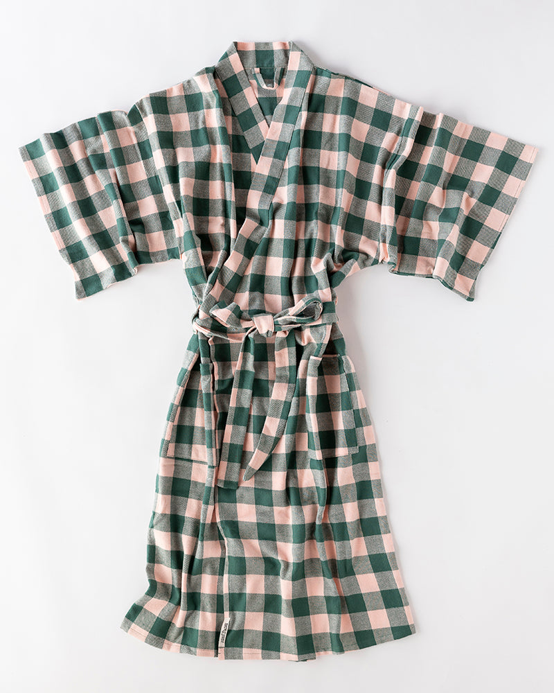 Plaid robe with green and pink pattern on a white background