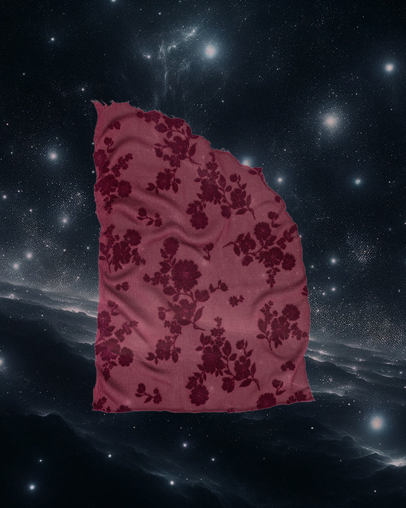 Sheer red fabric set against the stars