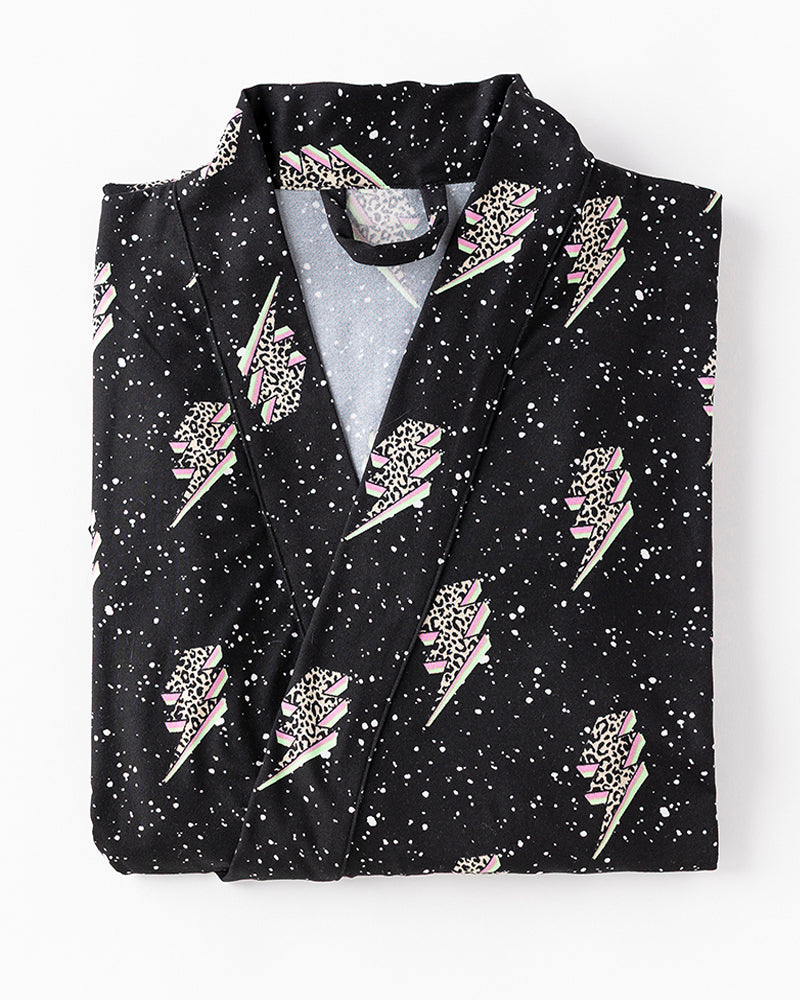 folded black robe with lightning bolts